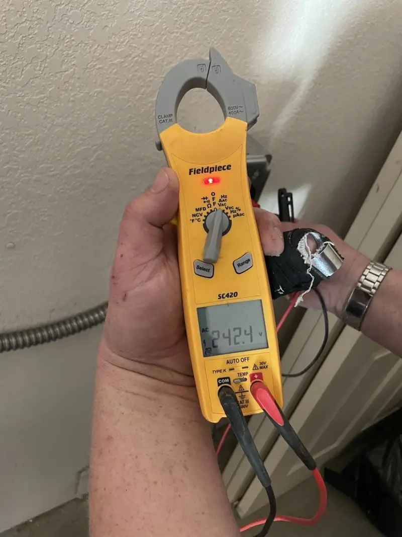 Voltage testing with clamp meter during Outlet Installation in Waterloo